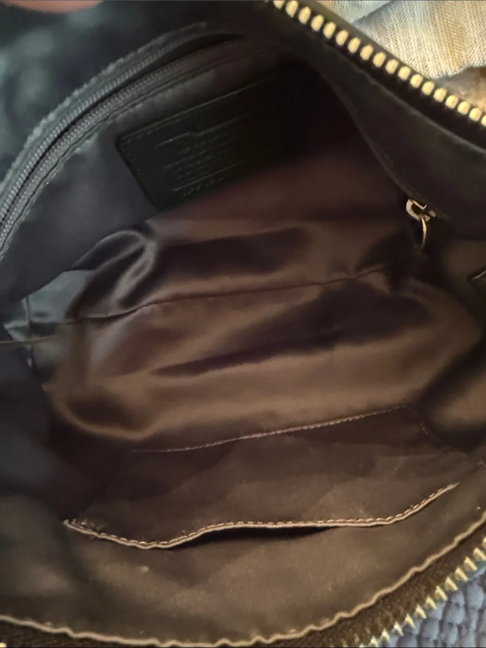 Coach Vintage Y2K Daisy Black Leather Shoulder Bag with Front Zip and Logo.